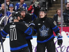Toronto Maple Leafs left wing Tyler Bertuzzi (59) celebrates his goal against the Washington Capitals with forward Max Domi (11) and defenceman TJ Brodie (78) during second period at Scotiabank Arean on Thursday night.