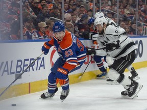 Ryan Nugent-Hopkins (93) of the Edmonton Oilers, skates away from Drew Doughty(8) of the Los Angeles Kings at Rogers Place in Edmonton on Feb. 26, 2024.