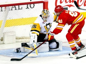 Calgary Flames Nazem Kadri scores a beauty goal against Pittsburgh Penguins goalie Tristan Jarry in third-period NHL action at the Scotiabank Saddledome in Calgary on Saturday, March 2, 2024.