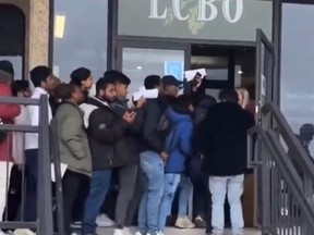 People line up to get into an LCBO job fair in London, Ont., on Saturday, March 16, 2024.