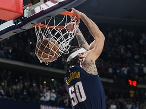 Denver Nuggets forward Aaron Gordon dunks against the Toronto Raptors in the first half of an NBA basketball game Monday, March 11, 2024, in Denver.