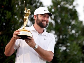 Scottie Scheffler of the United States celebrates with the trophy after winning during the final round of THE PLAYERS Championship at TPC Sawgrass last weekend.