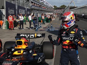 Red Bull's Max Verstappen celebrates achieving pole position, in the qualifying session of the Formula One Australian Grand Prix at the Albert Park Circuit in Melbourne on March 23, 2024.