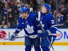 Maple Leafs forward William Nylander, left, celebrates his second period goal against the Rangers with Simon Benoit at Scotiabank Arena in Toronto, Saturday, March 2, 2024.
