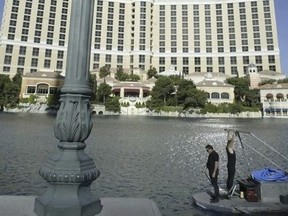 A crew cleans and tests the fountains at the Bellagio Casino and Hotel resort in Las Vegas, Nevada, on April 14, 2004.