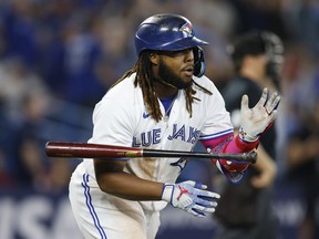 Vladimir Guerrero Jr. of the Blue Jays flips his bat after hitting a solo home run against the Cleveland Guardians in 2023.