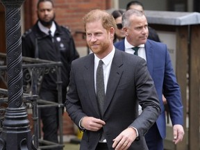 Britain's Prince Harry leaves the Royal Courts Of Justice in London, on March 30, 2023. Prince Harry's lawyer says the cover-up of unlawful information gathering at British tabloids owned by Rupert Murdoch went all the way to the top. Attorney David Sherborne said Wednesday, March 20, 2024 in the High Court that Murdoch was among the executives at News Group Newspapers aware of skullduggery carried out by journalists and private investigators working for the now-defunct News of the World, and The Sun.