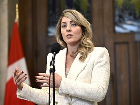 Foreign Affairs Minister Melanie Joly responds to questions from reporters in the Foyer of the House of Commons on Parliament Hill after Question Period, in Ottawa on Thursday, Feb. 29, 2024.