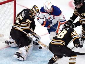 Boston Bruins goaltender Linus Ullmark (35) makes a save on a shot by Edmonton Oilers left wing Evander Kane (91) during the first period of an NHL hockey game Tuesday, March 5, 2024, in Boston.