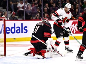 Carolina Hurricanes goaltender Frederik Andersen (31) makes a save as Ottawa Senators right wing Mathieu Joseph (21) plays in front, during second period NHL hockey action in Ottawa, on Sunday, March 17, 2024.