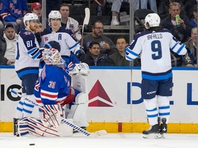 New York Rangers goaltender Igor Shesterkin (31) reacts as Winnipeg Jets center Mark Scheifele (55) celebrates after scoring with left wing Kyle Connor (81) and left wing Alex Iafallo (9) during the second period of an NHL hockey game, Tuesday, March 19, 2024, at Madison Square Garden in New York.