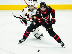 Ottawa Senators centre Josh Norris (9) moves the puck as Chicago Blackhawks centre Connor Bedard (98) puts pressure on him during first period NHL hockey action in Ottawa on Thursday, March 28, 2024.