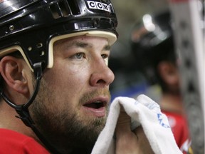 Chris Simon is pictured in March 2006 while he was a member of the Calgary Flames. 'He will always be remembered,' says Brian Kilrea, who was his coach while Simon played junior for the Ottawa 67's, 'because as good as he was and as tough as he was, he was just a gentle giant.'