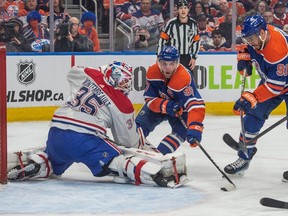 Connor McDavid (97) of the Edmonton Oilers, scores on goalie Sam Montembeault of the Montréal Canadiens at Rogers Place in Edmonton on March 19, 2024.