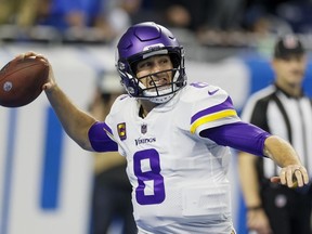 Former Minnesota Vikings' quarterback Kirk Cousins throws during the first half of an NFL football game against the Detroit Lions, Dec. 11, 2022, in Detroit. Cousins is leaving Minnesota for Atlanta, landing another big contract with a well-timed foray into free agency. Cousins' agent Mike McCartney announced on social media that his client has agreed to a four-year deal with the Falcons.