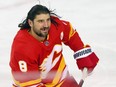 Calgary Flames' Chris Tanev takes warmup before a game earlier this season. He was traded to Dallas this week.