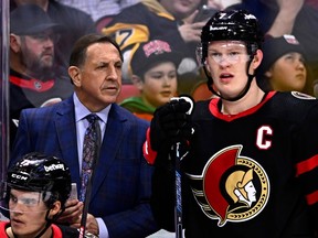 Ottawa Senators interim head coach Jacques Martin and Senators left wing Brady Tkachuk (7) look on during a break in the play during first period NHL hockey action against the Pittsburgh Penguins in Ottawa, on Saturday, Dec. 23, 2023.