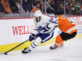 Toronto Maple Leafs' Wayne Simmonds, left, plays the puck past Philadelphia Flyers' Ivan Provorov during the first period of an NHL hockey game, Sunday, Jan. 8, 2023, in Philadelphia. After 15 hard-nosed NHL seasons where he filled the net and threw plenty of fists, Simmonds has called time on his playing career.