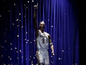 A statue in honour of former Los Angeles Lakers guard Kobe Bryant is displayed after being unveiled in a ceremony outside the NBA basketball team's arena, Feb. 8, 2024, in Los Angeles. The Lakers say they're planning to fix a handful of errors on the base of the statue of Kobe Bryant unveiled last month outside their arena.