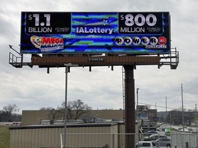 An electronic billboard advertises the Mega Millions and Powerball jackpots, Monday, March 25, 2024, in Des Moines, Iowa.