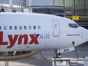 A Lynx Air Boeing 737 jet sits at a gate at the international airport in Calgary on Friday, February 23, 2024. Flair Airlines CEO Stephen Jones says he still hopes to add several Lynx Air planes to his fleet, even after their tentative merger deal fell through due to Lynx's shutdown last month.THE CANADIAN PRESS/Todd Korol