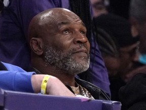 Mike Tyson watches the first half of an NBA basketball game between the Los Angeles Lakers and the New Orleans Pelicans, Feb. 27, 2022, in Los Angeles.
