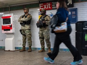 Members of the National Guard patrol a Manhattan subway station on March 18, 2024 in New York City.