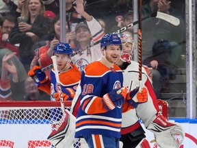 Edmonton Oilers Zach Hyman (18) smiles after scoring on Washington Capitals goalie Darcy Kuemper (35) during second period NHL action on Wednesday, March 13, 2024 in Edmonton.