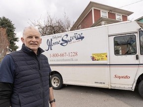 Mike Bryan with his milk truck in Vancouver, BC, March 21, 2024. Dairyland (which is now Saputo) is stopping home delivery of milk at the end of March.
