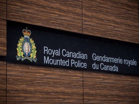 The RCMP logo is seen outside Royal Canadian Mounted Police "E" Division Headquarters, in Surrey, B.C., on Friday April 13, 2018. The Liberal government is looking for ways to improve policing services provided under contract by the RCMP across Canada -- eyeing everything from overall cost and sustainability to stronger oversight and accountability.