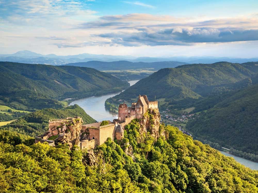 The Aggstein castle ruin and Danube River are pictured at sunset in Wachau, Austria.