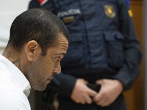 FILE - Brazilian soccer star Dani Alves sits during his trial in Barcelona, Spain, Monday, Feb. 5, 2024. A Spanish court has decided to release Brazilian soccer star Dani Alves if he pays a bail of one million euros and hands over his passports while awaiting the appeal of his conviction for raping a woman in Barcelona.
