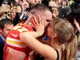 Taylor Swift and Travis Kelce kiss after the Super Bowl in February 2024.