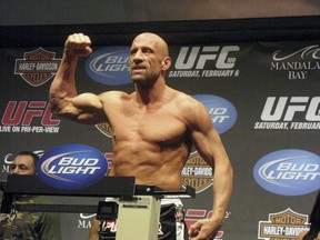 FILE - UFC Hall of Famer Mark Coleman gestures during the weigh-in ahead of his UFC 109 fight against Randy Couture Friday, Feb. 5, 2010, in Las Vegas. Former UFC champion Mark Coleman was airlifted to a hospital and was "battling for his life" after saving his parents from a house fire in Ohio this week, his daughter said on Instagram. Morgan Coleman posted Tuesday night, March 12, 2024, that her father went into the burning house several times and was able to bring out his mother and father.
