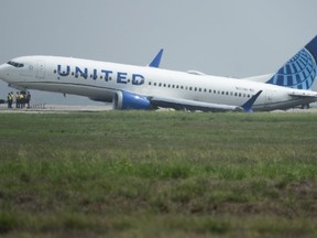 A United Airlines jet sits in a grassy area after leaving the taxiway Friday, March 8, 2024, at George Bush Intercontinental Airport in Houston. No passenger or crew injuries have been reported, according to a United Airlines spokesperson.
