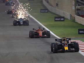 Red Bull Racing's Max Verstappen leads Ferrari's Charles Leclerc during the Bahrain Grand Prix at the Bahrain International Circuit in Sakhir on March 2, 2024.