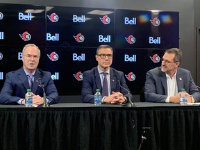 Dave Poulin (left) was named the Ottawa Senators' senior vice-president, hockey operations Sunday. The announcement was made at a press conference with Senators GM Steve Staios (centre) and owner Michael Andlauer.