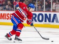 Canadiens' Arber Xhekaj steps into a slapshot during game at the Bell Centre in February. The rugged defenceman is looking for a new contract this off-season, after his entry-level deal expires.