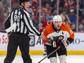 Flyers' Travis Konecny reacts while skating past linesman Jonathan Deschamps after being slashed by Canadiens' Kaiden Guhle last week at the Bell Centre.