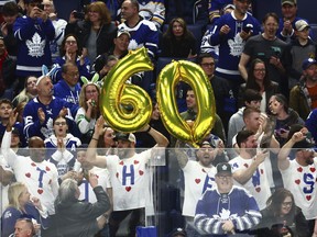 Maple Leafs fans celebrate Auston Matthews' 60th goal of the season.