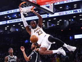 LeBron James of the Los Angeles Lakers dunks the ball against the Brooklyn Nets.