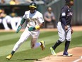 Esteury Ruiz of the Oakland Athletics rounds third base to score against the Cleveland Guardians.