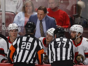 Ottawa Senators interim head coach Jacques Martin talks to referees.
