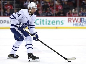 Auston Matthews of the Toronto Maple Leafs takes the puck during the first period against the New Jersey Devils at Prudential Center on April 9, 2024 in Newark, N.J.