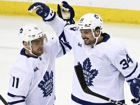 Toronto Maple Leafs' Auston Matthews (34) celebrates his goal with Max Domi (11).