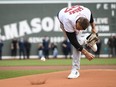 Rob Gronkowski, former NFL player for the New England Patriots spikes the ball on the mound for a ceremonial first pitch.