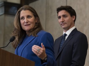 Prime Minister Justin Trudeau looks on as Deputy Prime Minister and Finance Minister Chrystia Freeland speaks in Ottawa, Friday, Oct. 7, 2022.