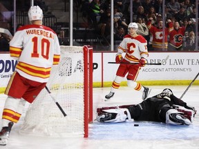Flames' Jonathan Huberdeau and Yegor Sharangovich skate past Coyotes goaltender Connor Ingram after Sharangovich scored during a game at 4,600-seat Mullett Arena in Tempe, Ariz., this year.
