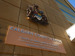 Exterior signage is shown at the Calgary Courts Centre in downtown Calgary on Monday, March 11, 2024.