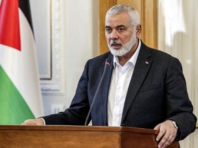 Ismail Haniyeh, the Doha-based political bureau chief of the Palestinian Islamist movement Hamas, speaks to the press after a meeting with the Iranian foreign minister in Tehran on March 26, 2024.